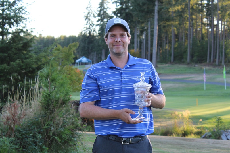 Man holding glass trophy