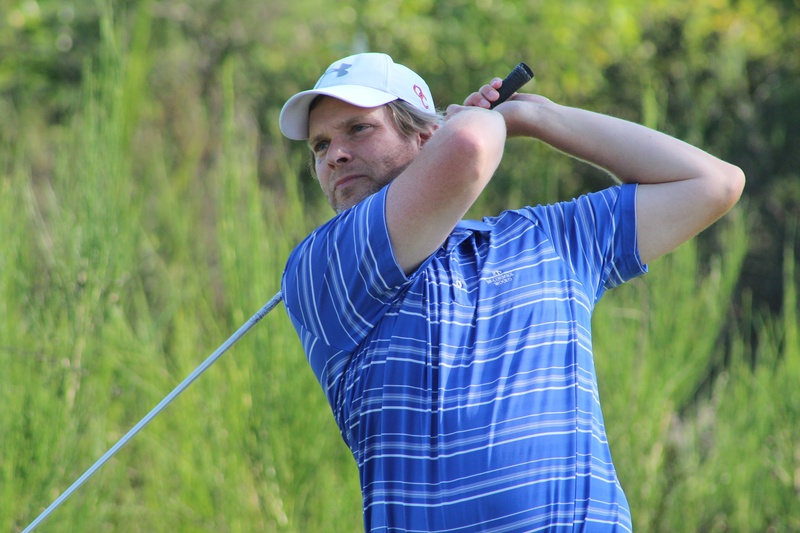 Bjorn Bjorke holding his form after hitting a golf ball.