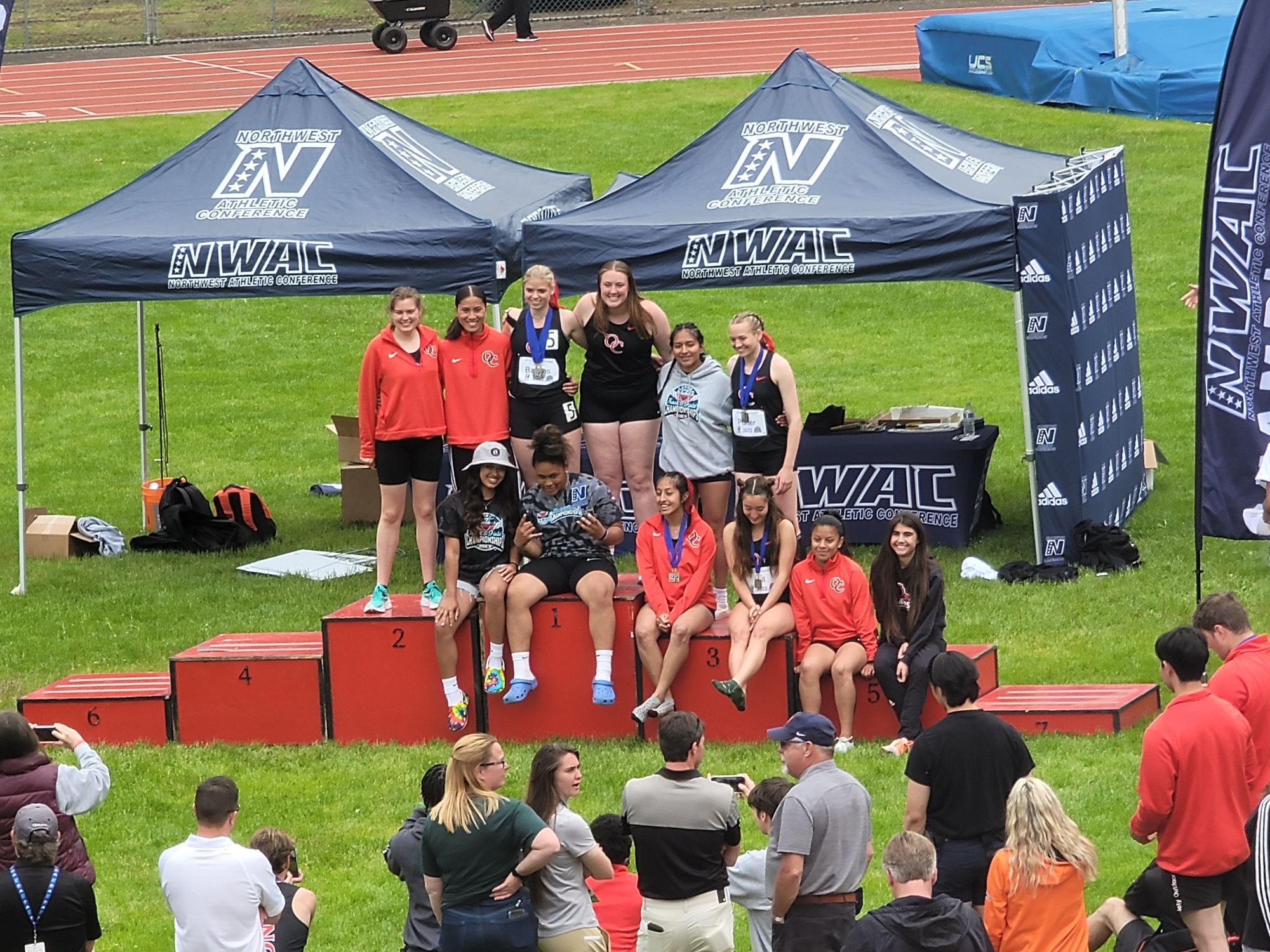 Women's track & field team on podium at track & field championships