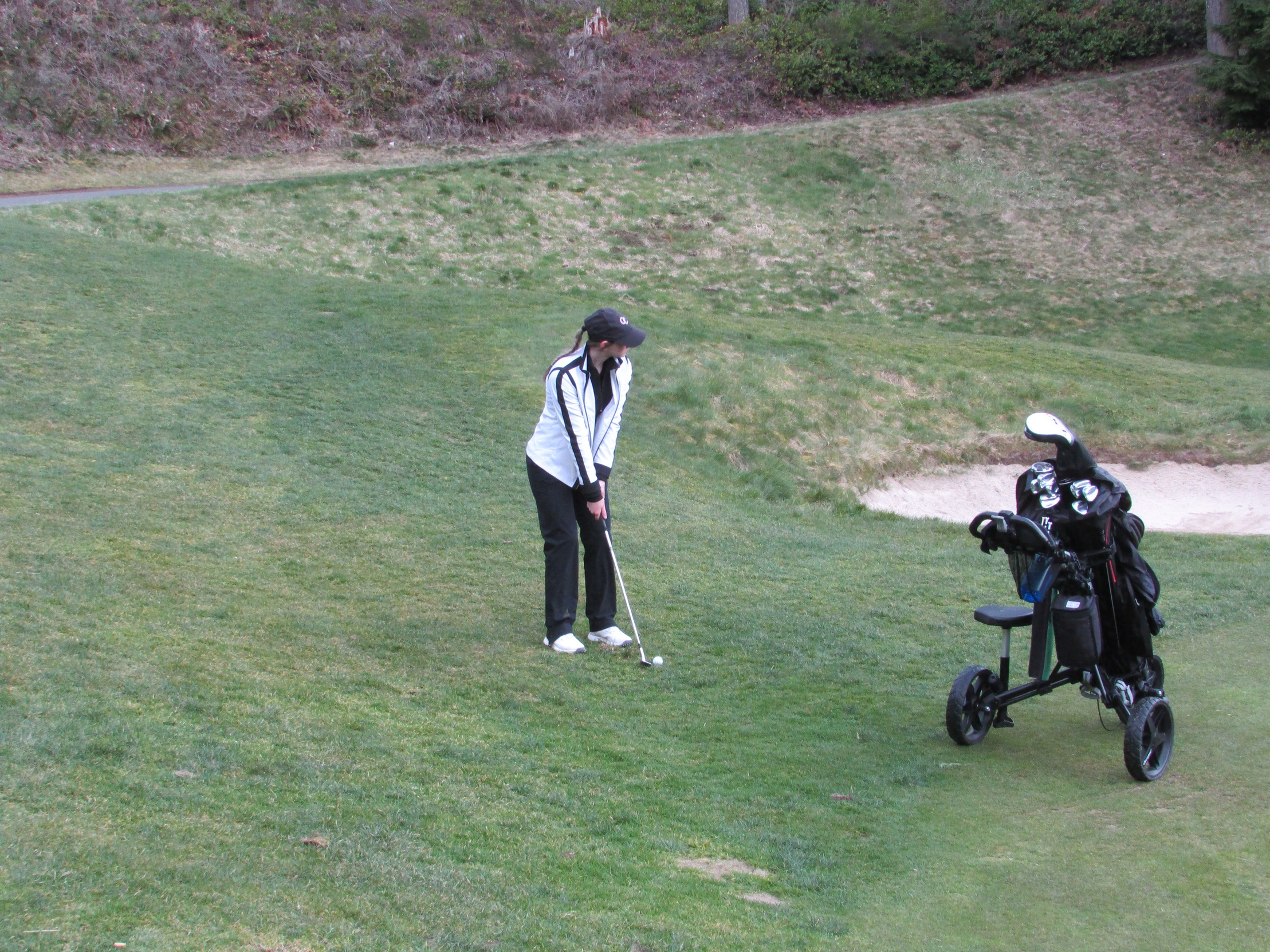 Nyah Dalton lines up her shot during a golf match.